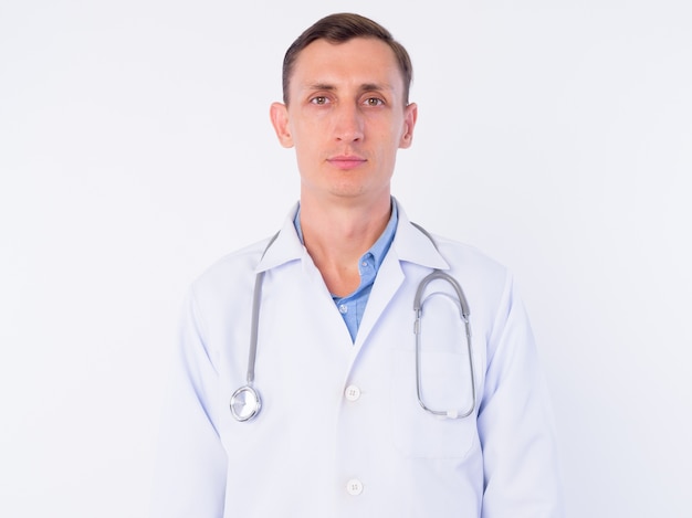  man doctor with stethoscope around neck isolated against white wall