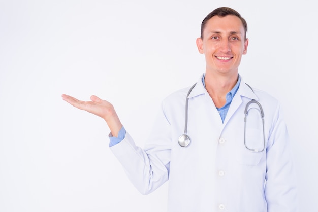  man doctor with stethoscope around neck isolated against white wall