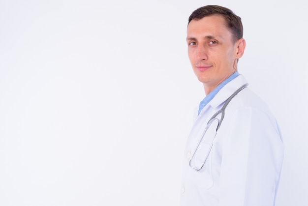  man doctor with stethoscope around neck isolated against white wall