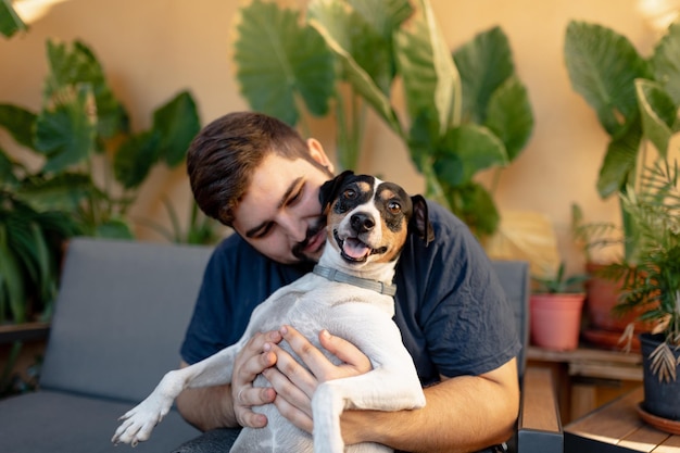 Man and dog sitting at home