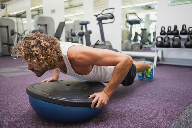 Man doing crossfit fitness workout in gym