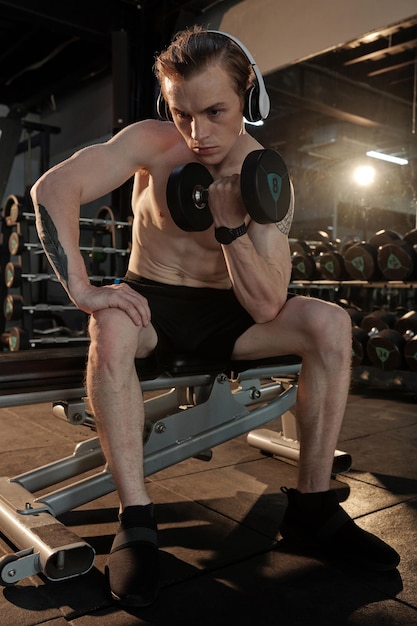 Man Doing Exercise with Dumbbell