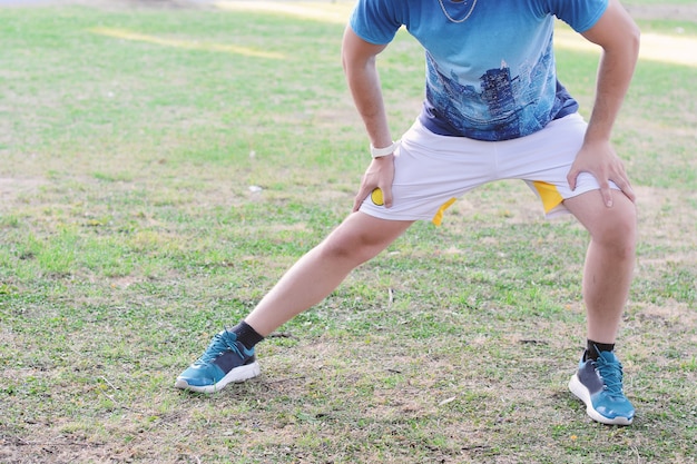 Man doing exercises at park.