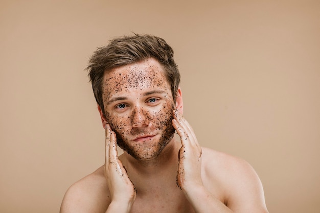 Man doing a face scrub