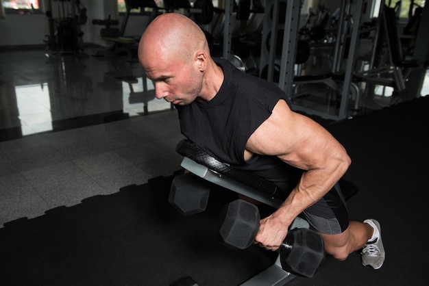 Man Doing Heavy Weight Exercise For Back