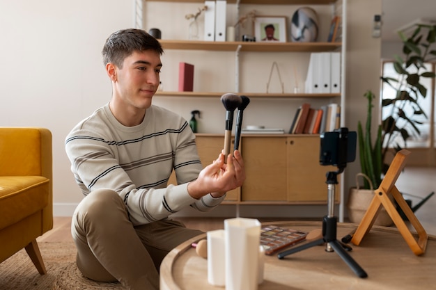 Man doing makeup indoors