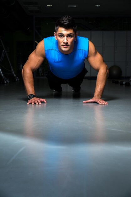 Man Doing Press Ups In Gym