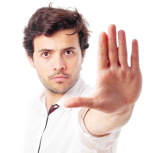 Man doing stop gesture on a white background