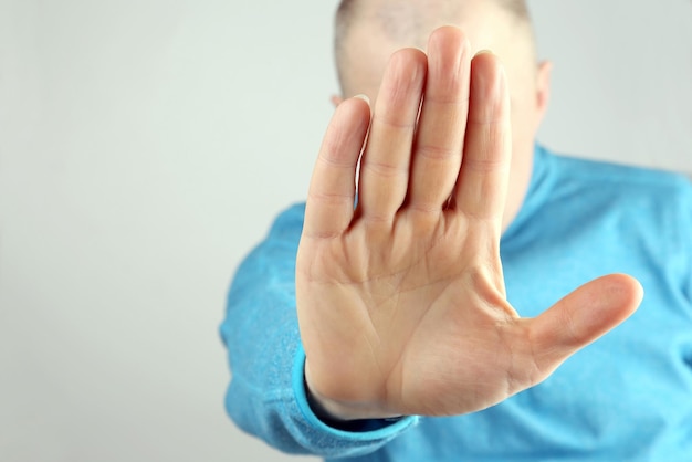 Man doing stop gesture with the right handxA