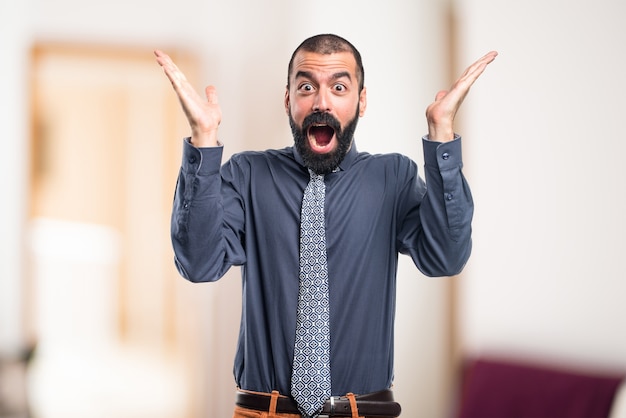 Man doing surprise gesture on unfocused background