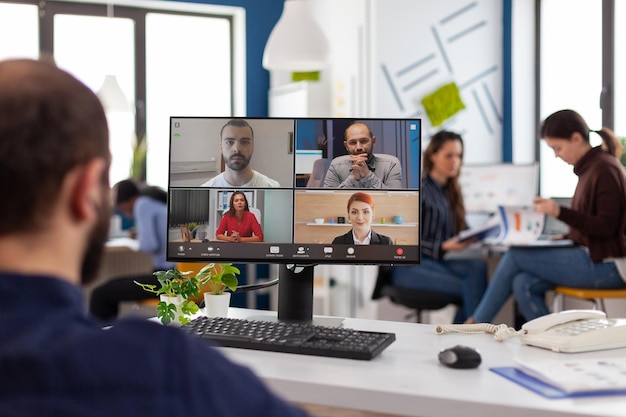 Man doing video call on laptop in office