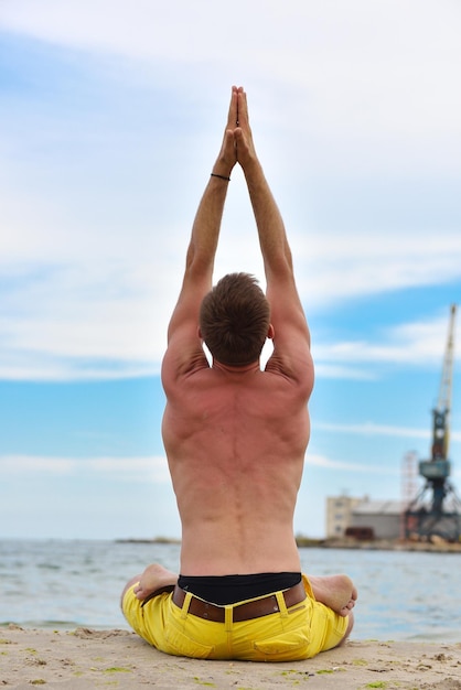 Man doing yoga exercises