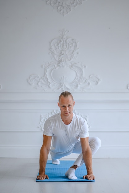 Man doing yoga at home. Yoga and healthy lifestyle concept