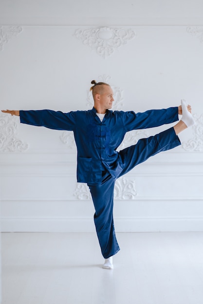 Man doing yoga at home