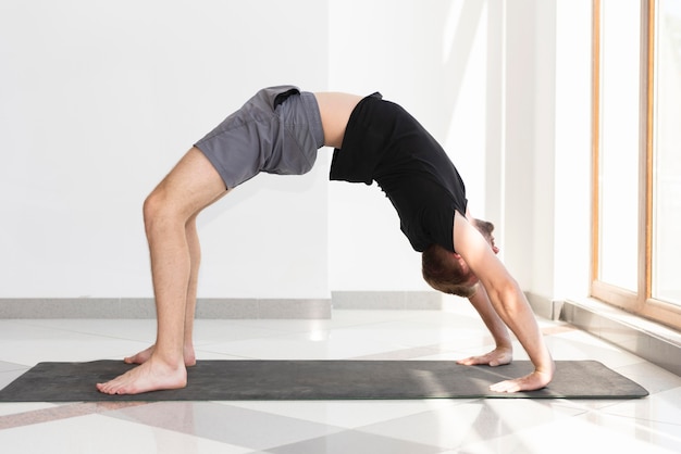 man doing yoga indoor