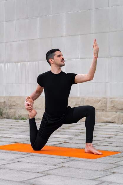 Man doing yoga outside