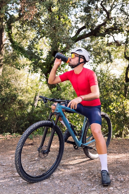 Man dressing next to his van to go cycling