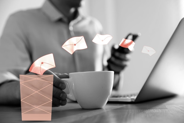 Photo man drinking coffee while working at table closeup envelopes flying from laptop into trash bin illustration of spam removing