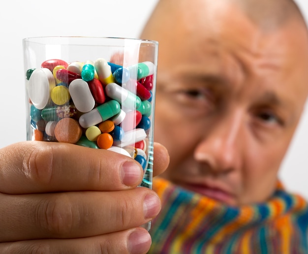 Man drinking pills