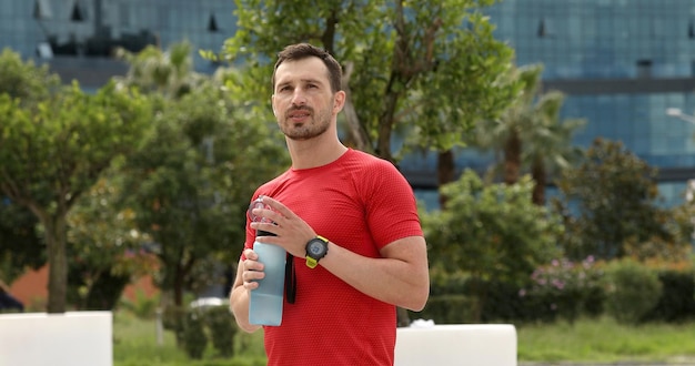 Man Drinking Water After Running.