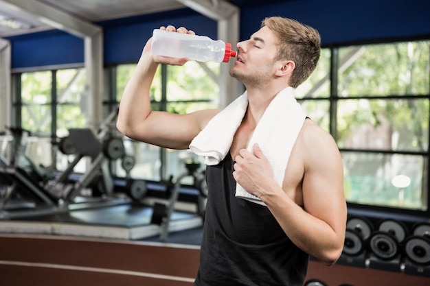 Man drinking water after workout