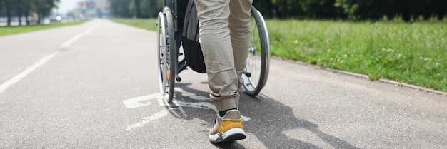 Man drive person in wheelchair friend visit someone in nursing house