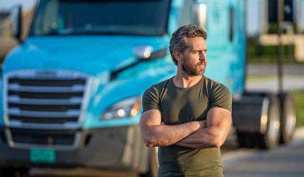 man driver near lorry truck man driver near lorry truck Truck driver Trucking owner Transportation vehicles hispanic man posing in front of truck Semi trucks vehicle copy space