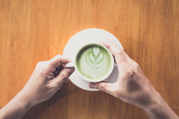 Man eating green tea with milk