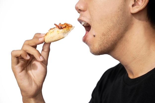 Man eating a slice of pizza with a white background