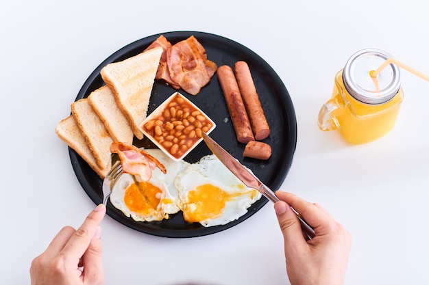 Man eating traditional full English breakfast