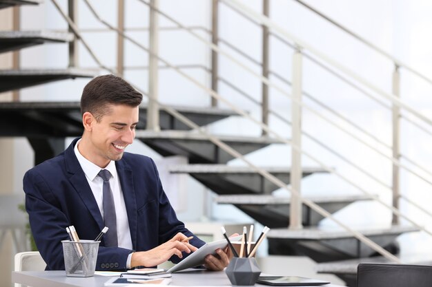 Man in elegant suit at workplace