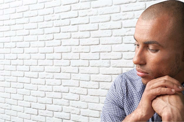 Man in Emotional Stress holding head with hands isolated on white