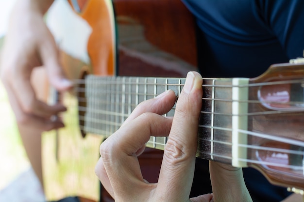 Man enjoy playing guitar