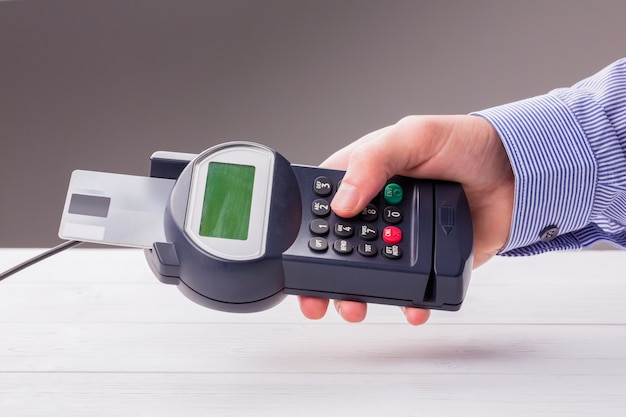 Man entering his pin on terminal