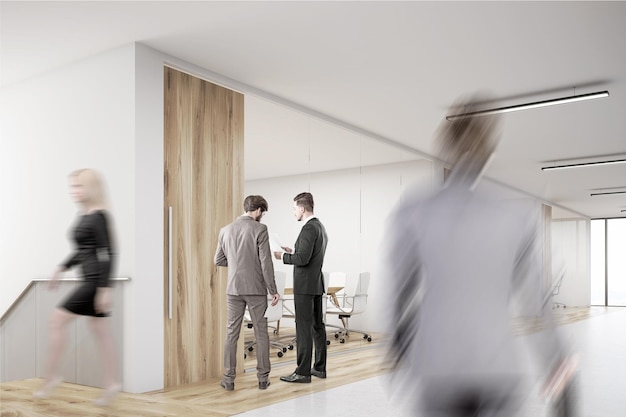 Man entering office with lots of people