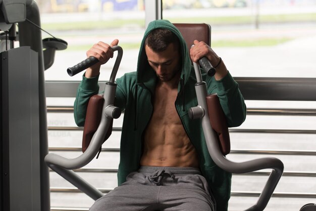 Man Exercising Chest In The Gym