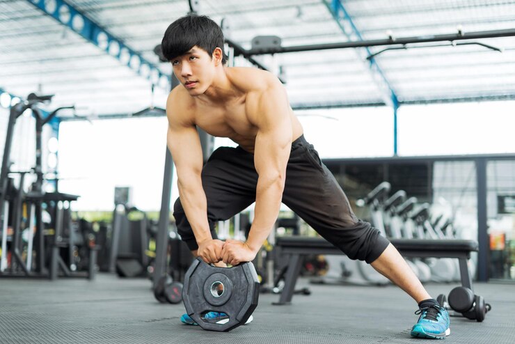 Photo ジムで運動している男性