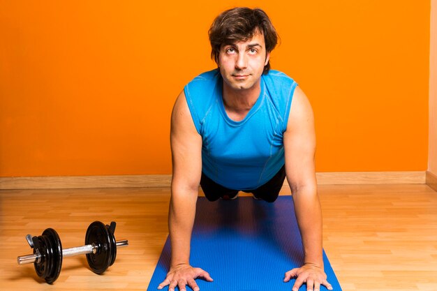 Man exercising on mat