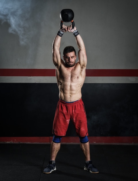 Man exercising with kettlebell
