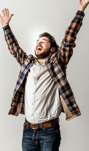 man expressing joyful triumph with arms raised