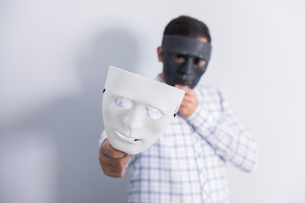 Man face black mask and hand white mask