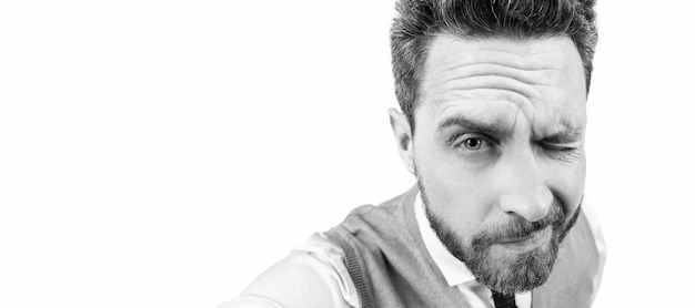 Man face portrait banner with copy space grizzled man closeup portrait serious mature elegant man with beard making selfie