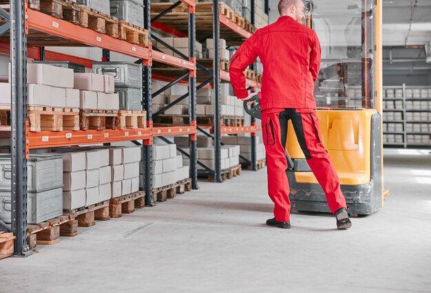 Man in factory using forklift