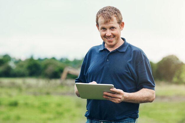 man farmer and portrait with tablet in nature for inspection schedule tasks and planning crop updates male person farm and internet for communication with supplier and agricultural apps