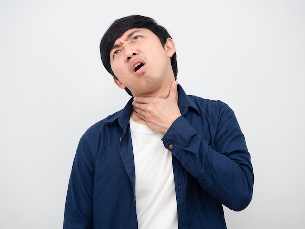 Man feeling pain his neck unhappy face portrait white background