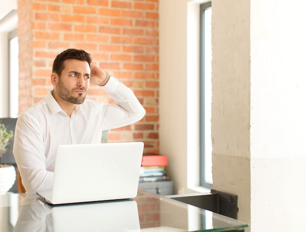 man feeling puzzled and confused, scratching head and man looking to the side