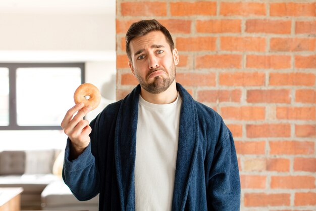 Man feeling sad and whiney with an unhappy look, crying with a negative and frustrated attitude