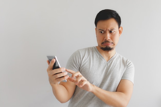 Man feels hate and disgusted with what show on the smartphone.