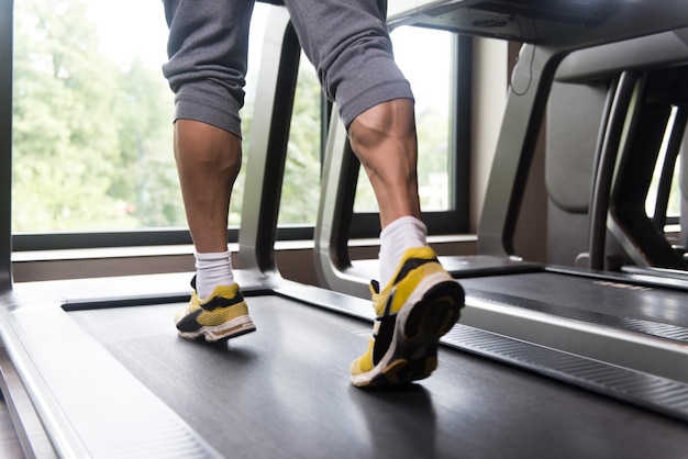 Premium Photo | Man feet on treadmill