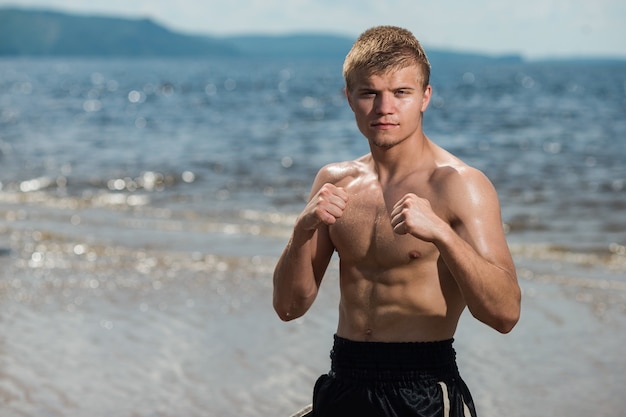 Man fighter stands in a Boxing stance